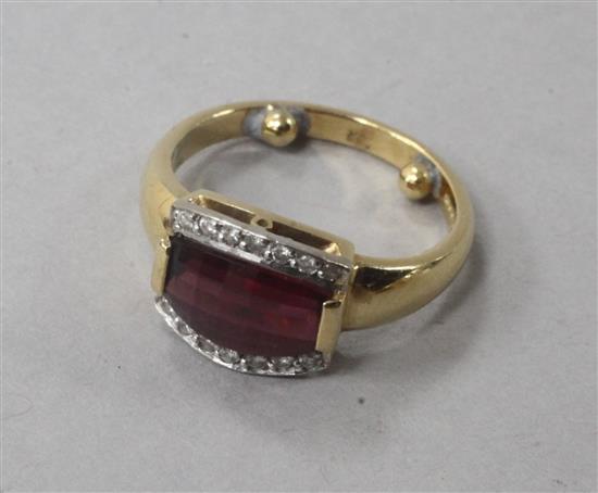 A 18ct gold, garnet and diamond dress ring, size G.